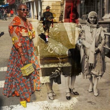 A woman in a colorful dress stands next to historical black-and-white figures in an urban setting.